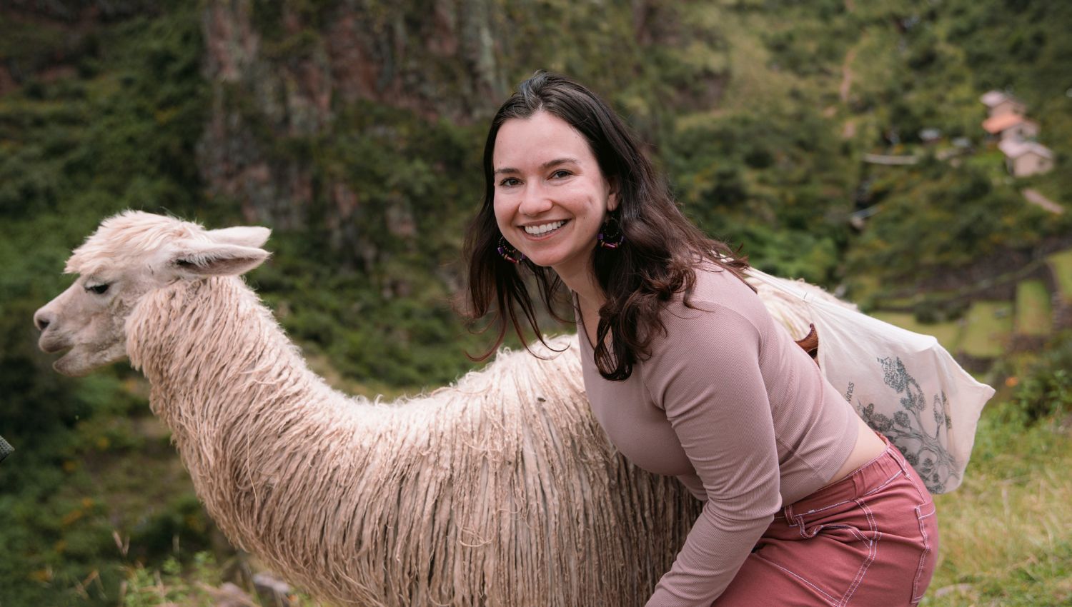 Female tourist with a llama